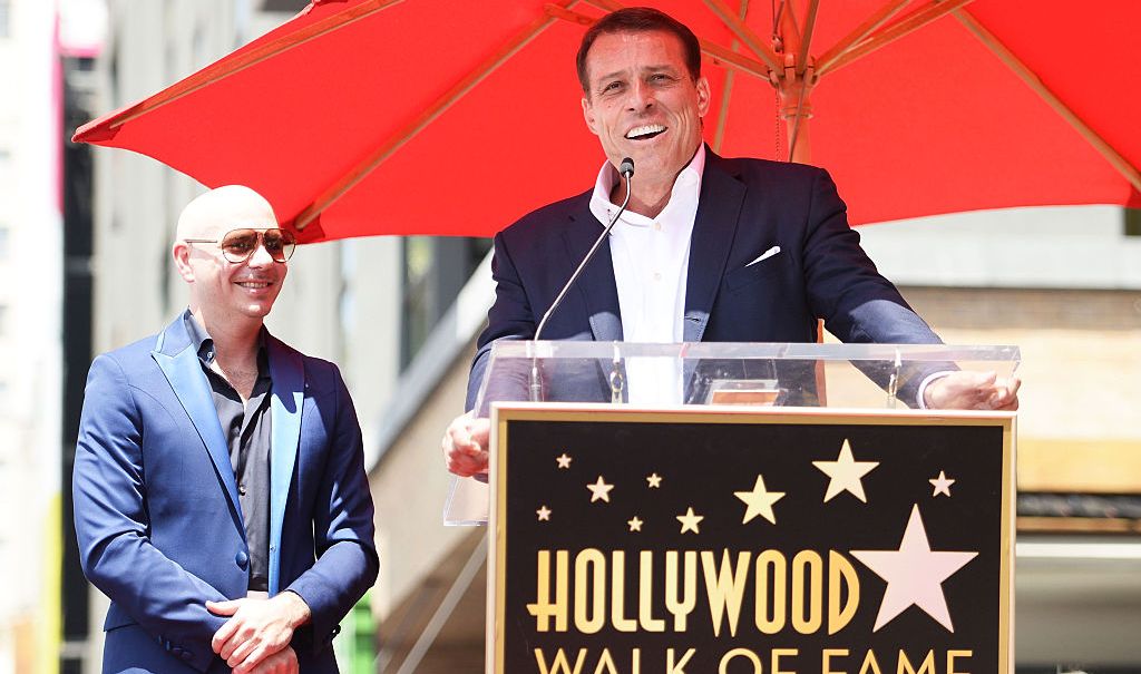 Pitbull (L) and Tony Robbins speak onstage as Pitbull is honored with a Star on The Hollywood Walk of Fame on July 15, 2016 in Hollywood, California. (Photo by Matt Winkelmeyer/Getty Images)