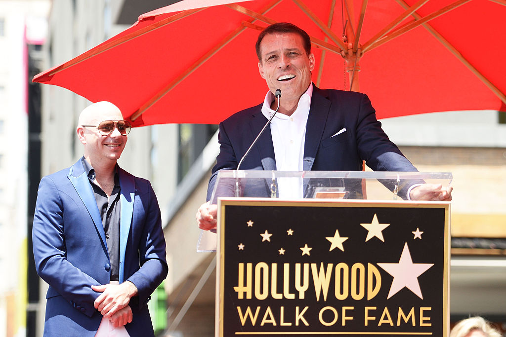 Pitbull (L) and Tony Robbins speak onstage as Pitbull is honored with a Star on The Hollywood Walk of Fame on July 15, 2016 in Hollywood, California. (Photo by Matt Winkelmeyer/Getty Images)