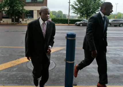 Former FBI agent William Don Tisaby, left, is accompanied by attorney Jermaine Wooten as he turns himself in at St. Louis Police headquarters on Monday, June 17, 2019, in St Louis. Tisaby has been charged in a perjury investigation related to the prosecution of former Missouri Gov. Eric Greitens. (Robert Cohen/St. Louis Post-Dispatch via AP)