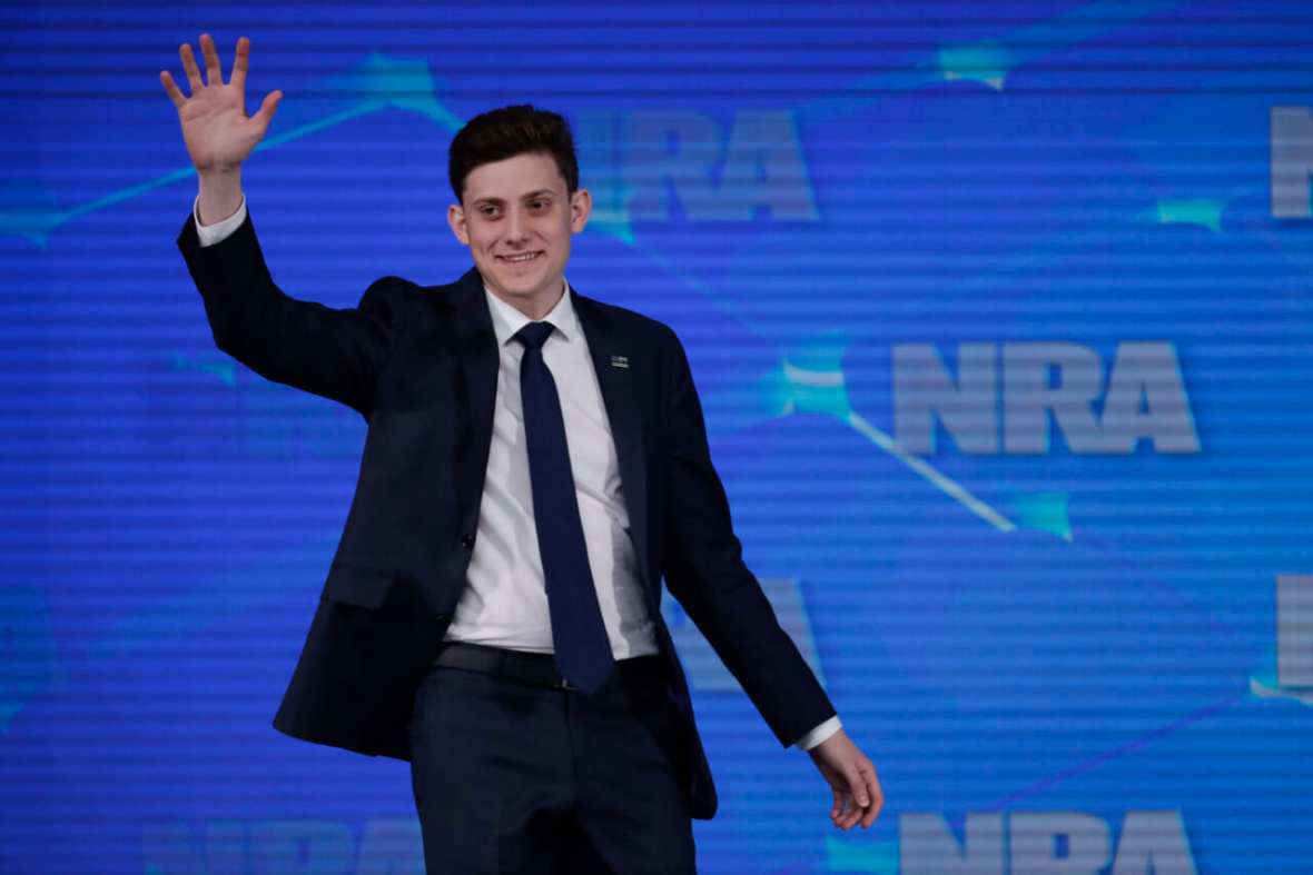 In this April 26, 2019 file photo, Kyle Kashuv, a survivor of the Marjory Stoneman Douglas High School shooting in Parkland, Fla., speaks at the National Rifle Association Institute for Legislative Action Leadership Forum in Indianapolis. On Monday, June 17, 2019, Kashuv said that Harvard University revoked his acceptance over racist comments he made online and in text messages about two years ago. (AP Photo/Michael Conroy, File)