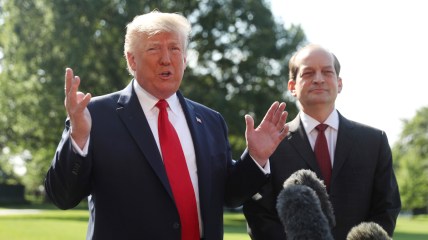 President Donald Trump speaks to members of the media with Secretary of Labor Alex Acosta on the South Lawn of the White House, Friday, July 12, 2019, before Trump boards Marine One for a short trip to Andrews Air Force Base, Md. and then on to Wisconsin. (AP Photo/Andrew Harnik)