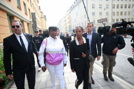 Renee Black, 2nd left, ASAP Rocky's mother, arrives to the district court where US rapper A$AP Rocky is to appear on charges of assault, in Stockholm, Sweden, Tuesday July 30, 2019. American rapper A$AP Rocky and two other men believed to be members of his entourage are going on trial Tuesday in Sweden in a high-profile legal case that has caught the attention of U.S. President Donald Trump and rallied music and entertainment celebrities among others. (Fredrik Persson / TT via AP)