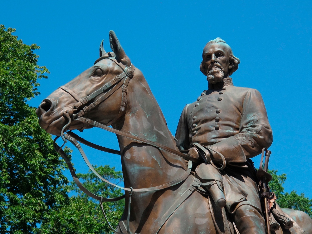 In this Aug. 18, 2017, photo, a statue of Confederate Gen. Nathan Bedford Forrest sits in a park in Memphis, Tenn. A city council in Tennessee plans to consider four different ways to deal with the growing uproar over the existence of two statues of Confederate leaders at city parks. Council members in Memphis agreed Tuesday, Aug. 22, to discuss a resolution listing steps it can take to remove or board up statues of Jefferson Davis and Nathan Bedford Forrest. (AP Photo/Adrian Sainz, File)