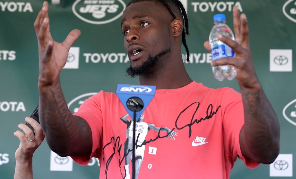 New York Jets running back Le'Veon Bell speaks to reporters after a practice at the NFL football team's training camp in Florham Park, N.J., Thursday, July 25, 2019. (AP Photo/Seth Wenig) thegrio.com