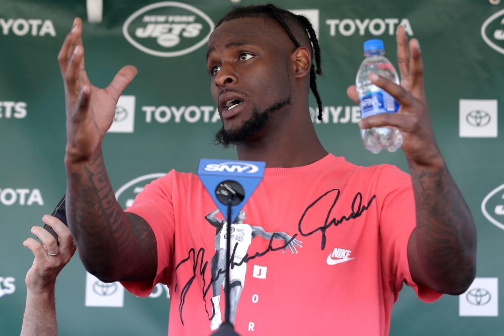 New York Jets running back Le'Veon Bell speaks to reporters after a practice at the NFL football team's training camp in Florham Park, N.J., Thursday, July 25, 2019. (AP Photo/Seth Wenig) thegrio.com