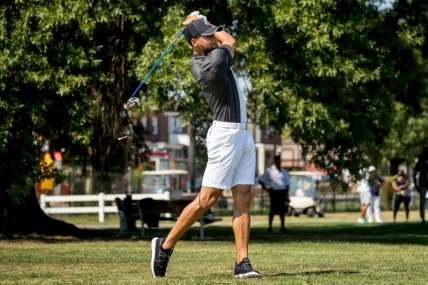 Golden State Warriors guard Stephen Curry tees off at Langston Golf Course in Washington, Monday, Aug. 19, 2019, following an announcement that he would be sponsoring the creation of men’s and women’s golf teams at Howard University. (AP Photo/Andrew Harnik)