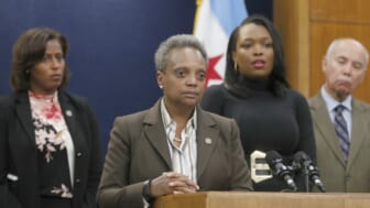 Chicago police turn backs on an approaching Mayor Lightfoot after cop shootings