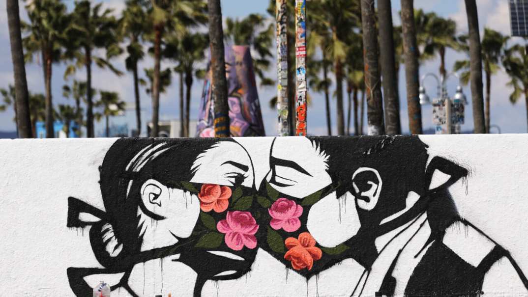 mural kissing coronavirus theGrio.com