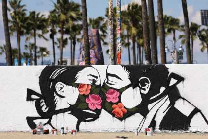 mural kissing coronavirus theGrio.com