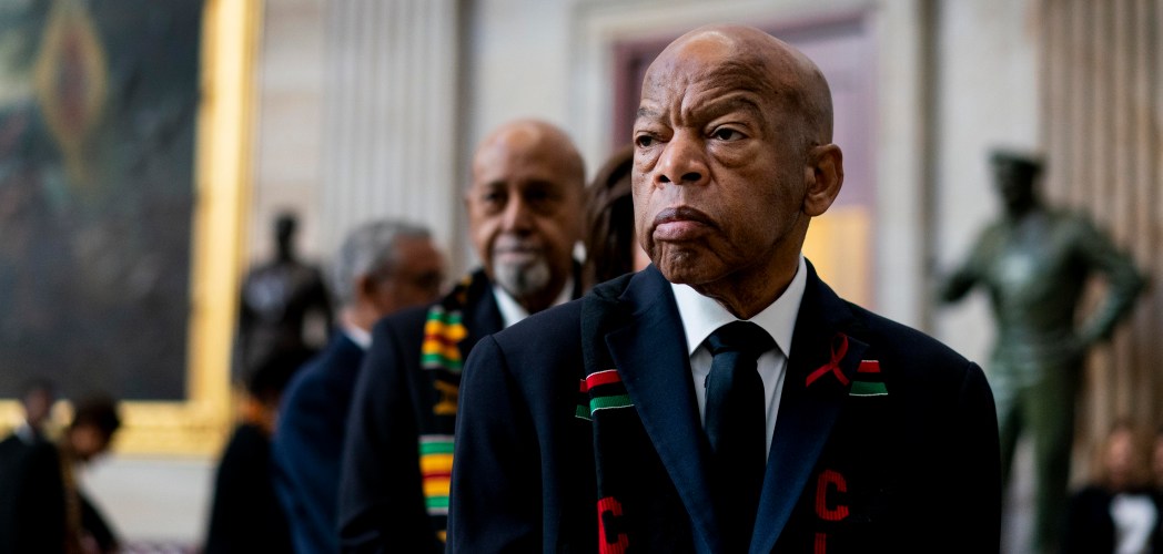 Rep. John Lewis stands solemnly, preparing to pay his respects to Rep. Elijah Cummings during a memorial ceremony in the Capitol's Statuary Hall in 2019.