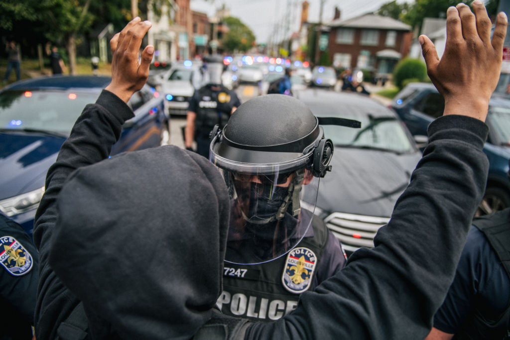 Louisville officer shot, but unclear if tied to protests