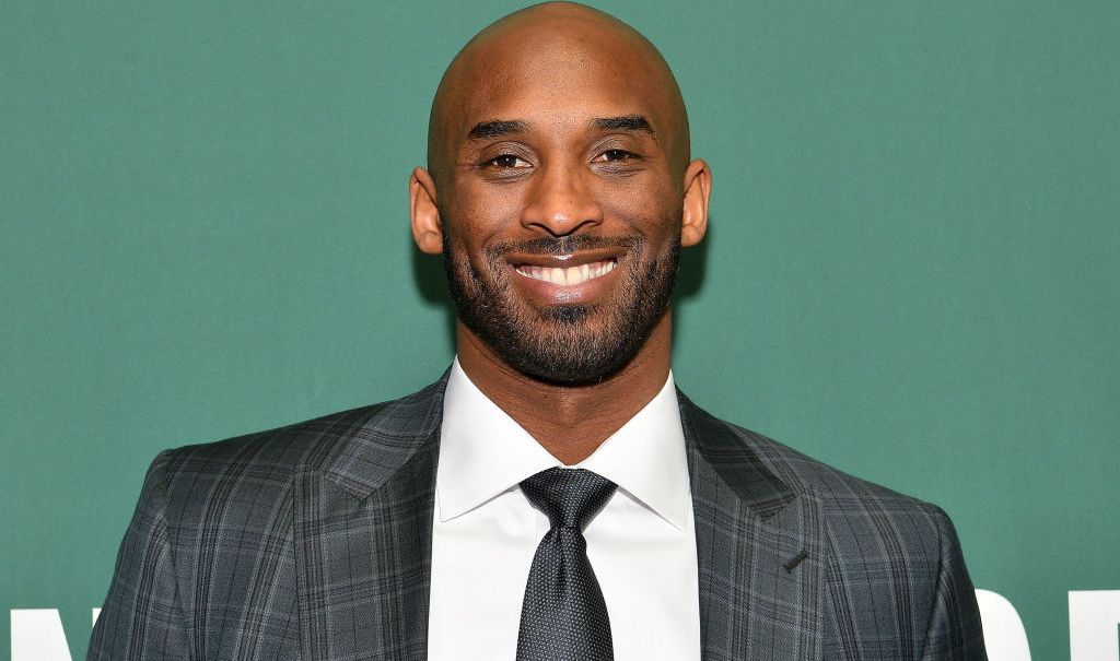 Kobe Bryant Signs Copies Of His Book "Training Camp (The Wizenard Series #1)"