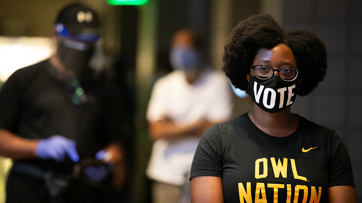 Ashley Nealy waits in line to vote