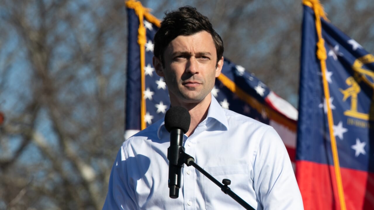 Ossoff forced to debate empty podium after Perdue refuses to show - TheGrio