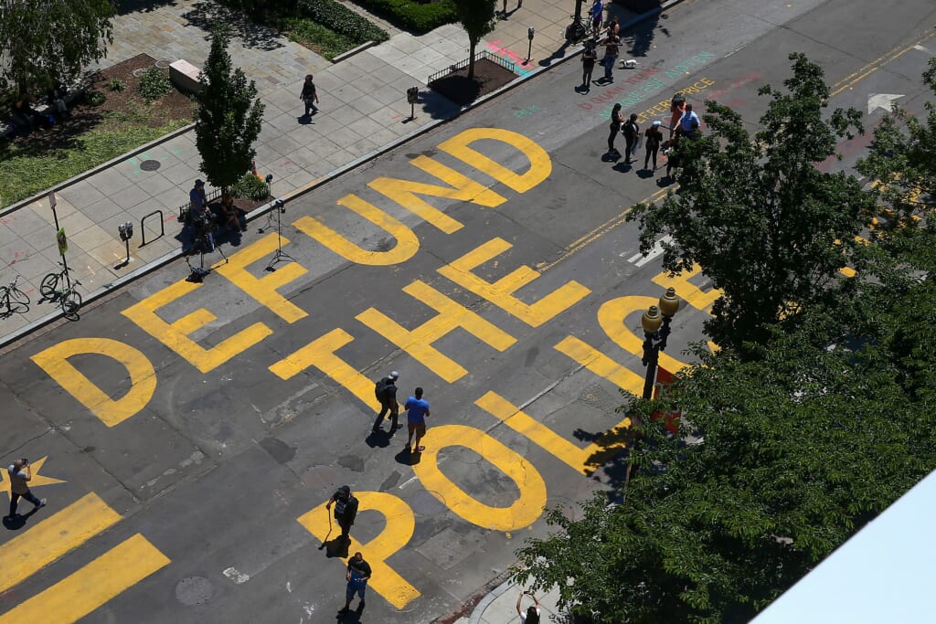Protestors Add "Defund The Police" Messaging To Washington DC Street