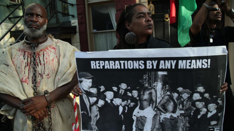 Activist Groups Protest Against Senate Majority Leader McConnell On National Reparations Day