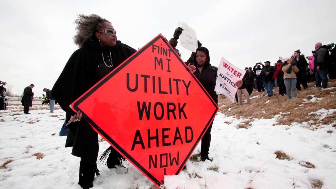 People protest at the Flint Water Plant