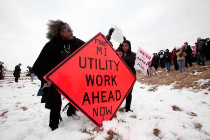 People protest at the Flint Water Plant