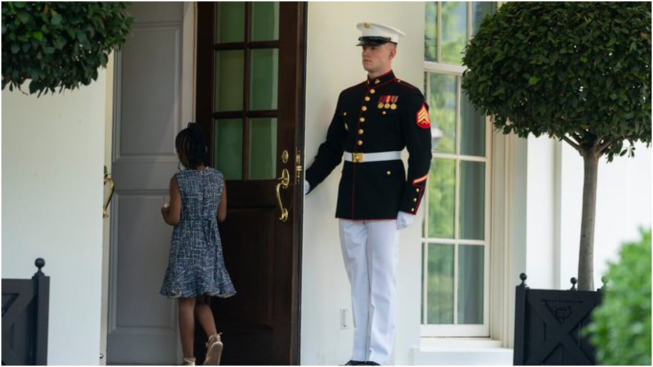 Photo of marine holding door for Gianna Floyd at White House goes viral