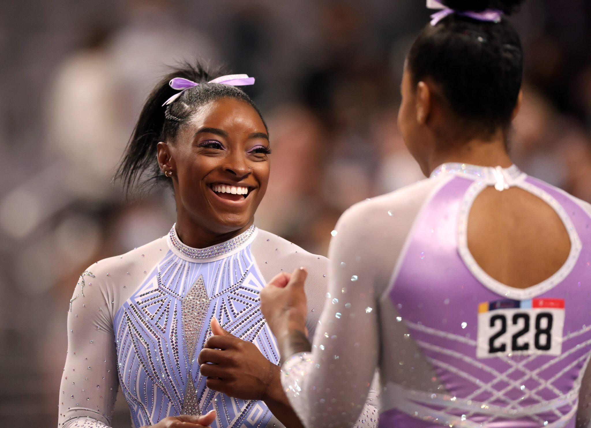 Simone Biles fixes younger Black gymnast hair in sweet viral clip