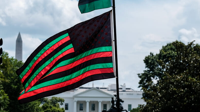 A Pan-African flag flies from Black Lives Matter Plaza overlooking the White House