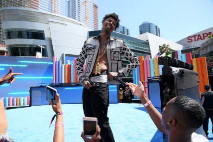 Rapper Blueface attacked by fan after exhibition boxing match