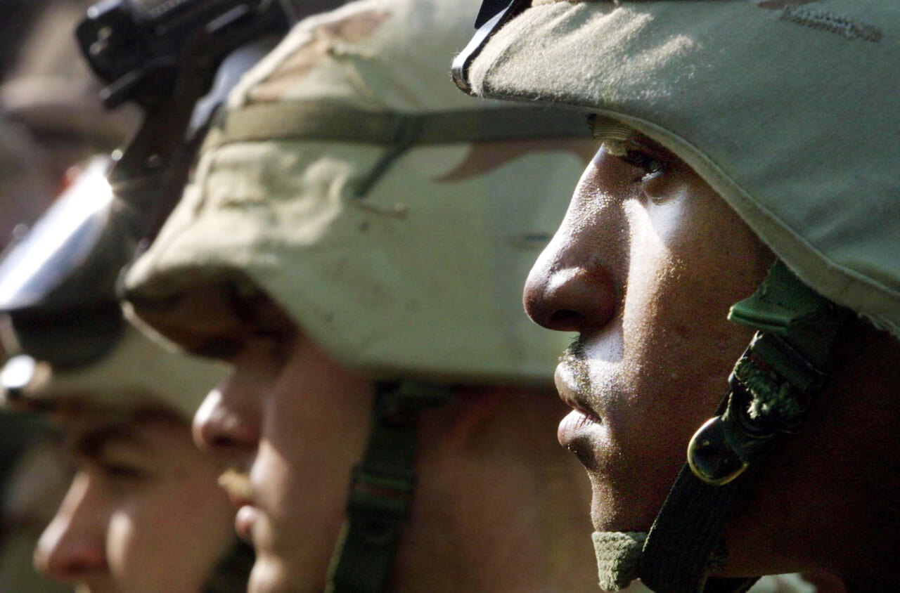 U.S. Army 101st Airborne Division E4 Bobby with other soldiers