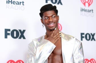 Lil Nas X poses in pregnancy photo shoot ahead of album release