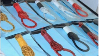 South African designer issues apology for ‘rope ties’ that favor nooses