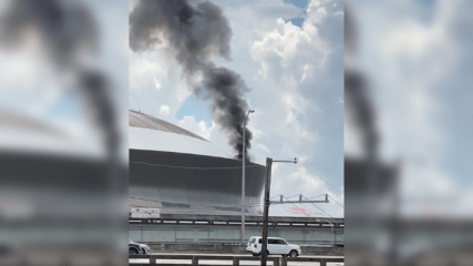 Flames pour from section of Superdome roof in New Orleans
