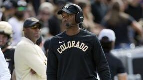 Colorado AD apologizes after football coach shoves TV camera