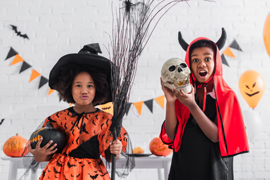 Black children in Halloween costumes