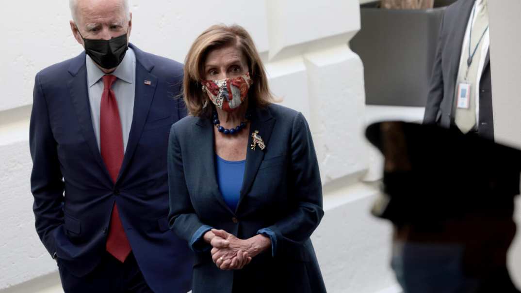 U.S. President Joe Biden, accompanied by Speaker of the House Nancy