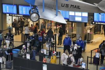 Hundreds more flights canceled because of staff shortages