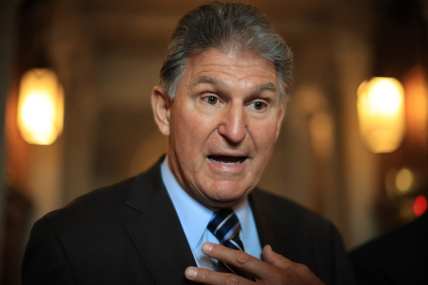 Democrats vow to push through climate and social spending bill despite Manchin