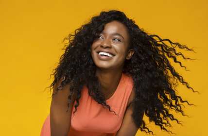 Young Black woman laughing