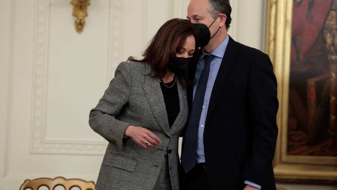 Second Gentleman Douglas Emhoff kisses his wife, Vice President Kamala Harris