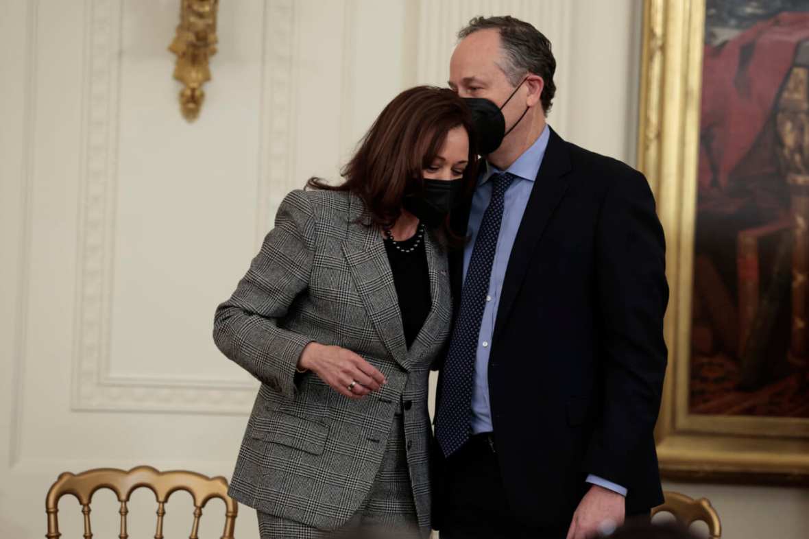 Second Gentleman Douglas Emhoff kisses his wife, Vice President Kamala Harris