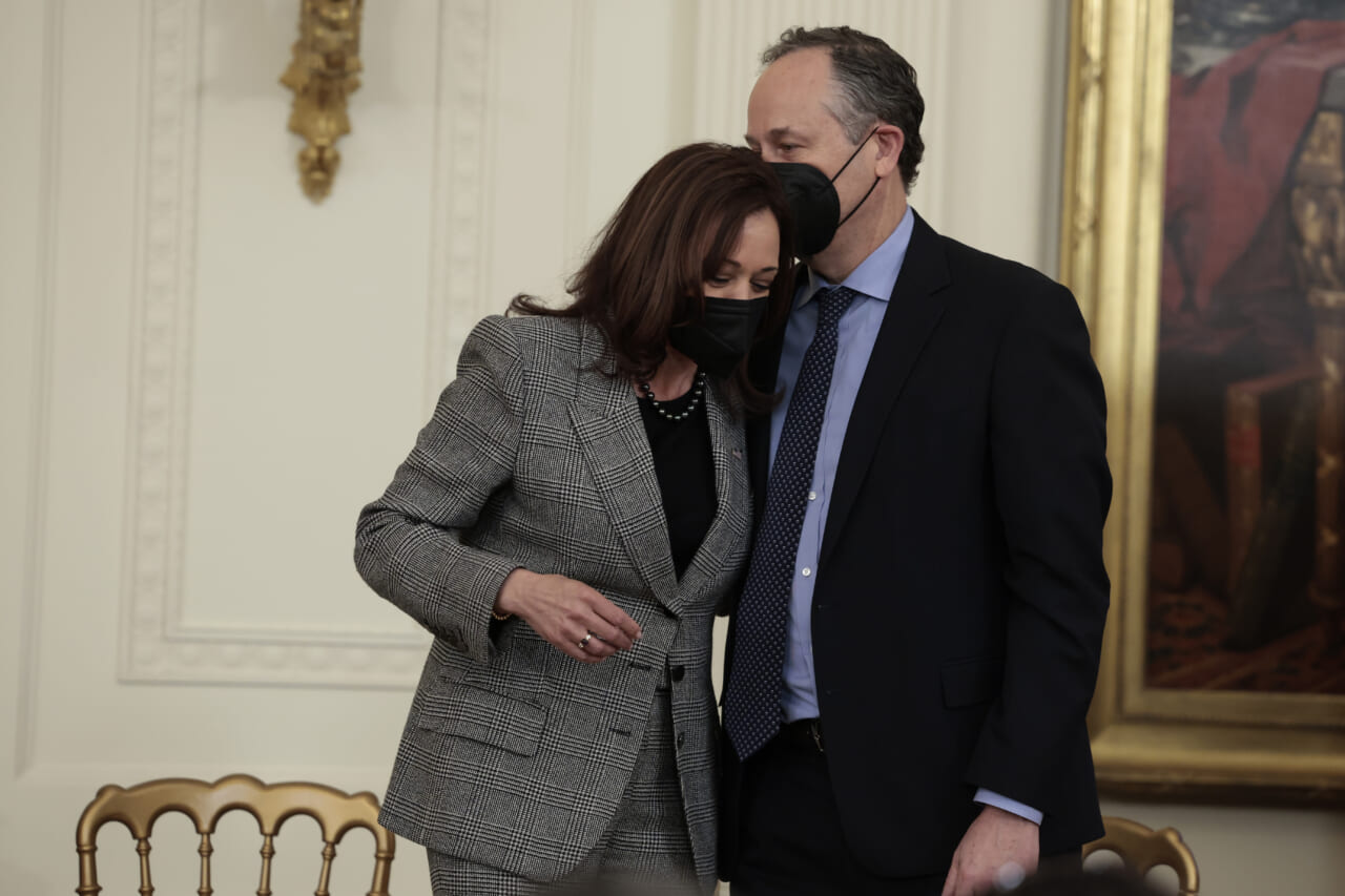 Second Gentleman Douglas Emhoff kisses his wife, Vice President Kamala Harris