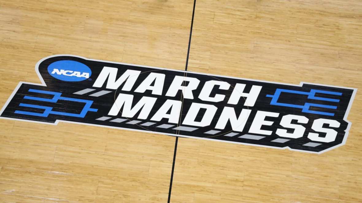 The March Madness logo on a basketball court