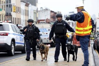 Police hunt gunman who wounded 10 in Brooklyn subway attack