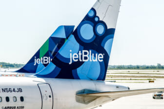 Why is JetBlue trying to purchase Spirit Airlines?