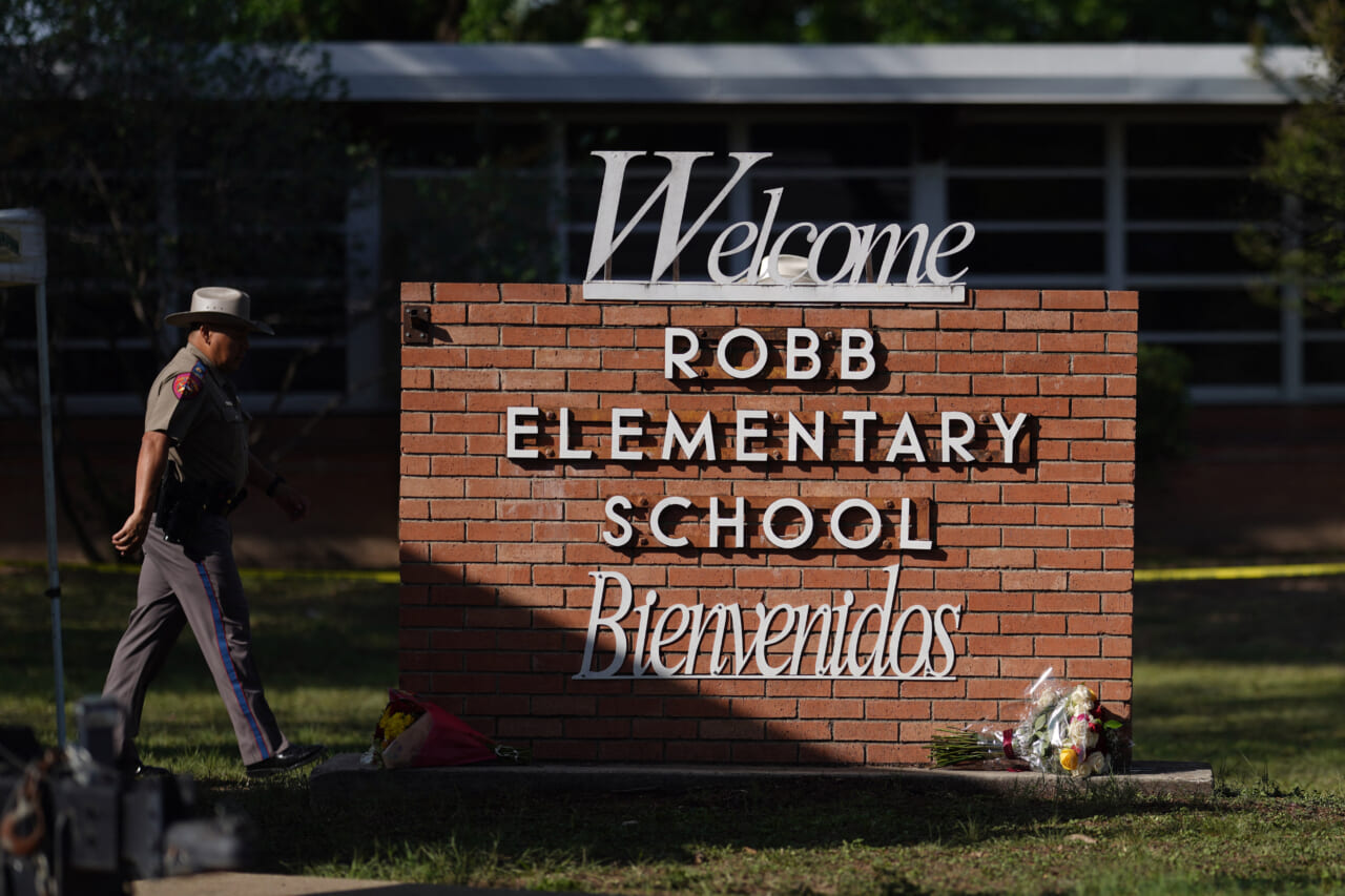 An officer walks outside of Robb Elementary School in Uvalde, Texas