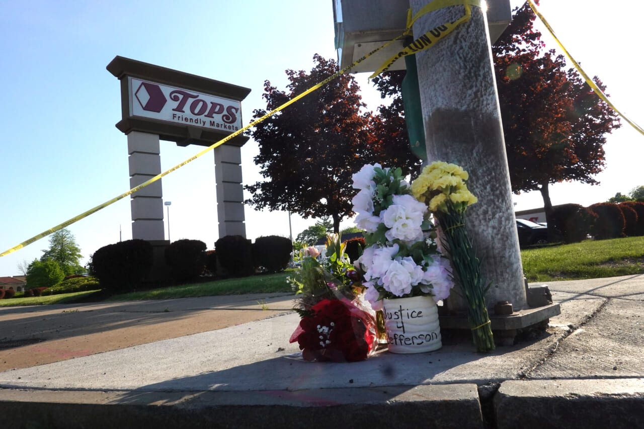 Flowers at a makeshift memorial outside Tops market