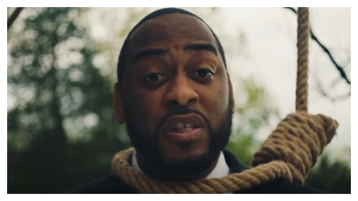 Charles Booker wears a noose in his Senate campaign video