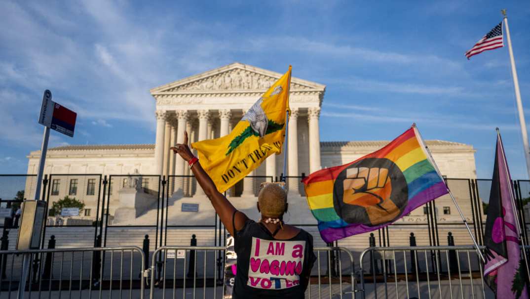 Nadine Sciler dances in front of the Supreme Court Building