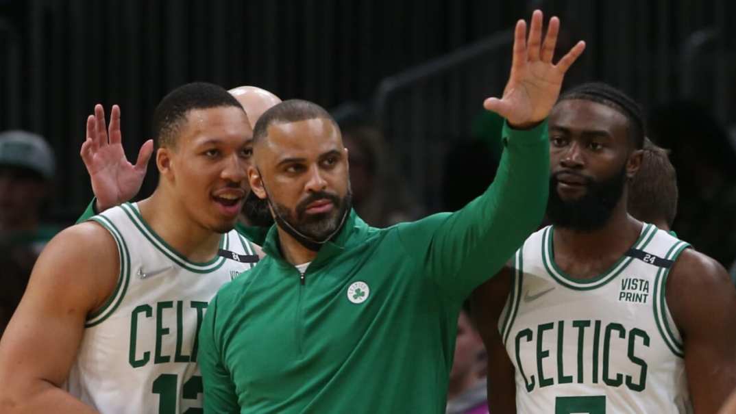 Grant Williams of the Boston Celtics talks with head coach Ime Udoka