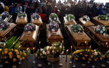 Funeral held for 19 of the 21 underage teenagers who died as they danced in a South African club