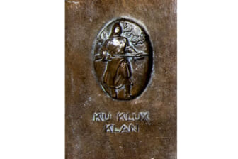 Federal commission finds KKK plaque with hooded figure at West Point building