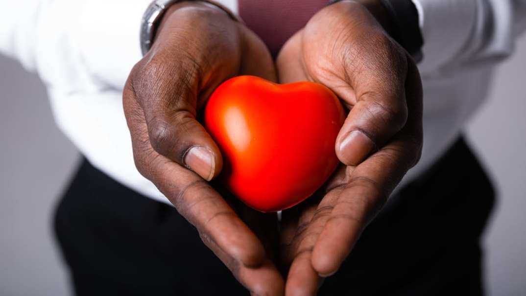 Hands holding a heart-shaped object